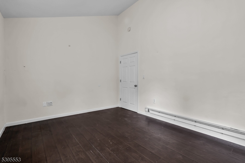 932 Wheatsheaf Road Roselle, NJ 07203 - Photo 33 of 44 an empty room with wooden floor