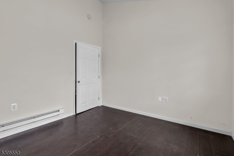 932 Wheatsheaf Road Roselle, NJ 07203 - Photo 36 of 44 an empty room with wooden floor
