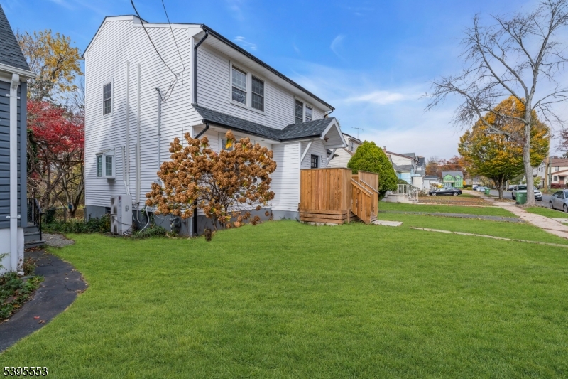 932 Wheatsheaf Road Roselle, NJ 07203 - Photo 4 of 44 a view of a house with a yard
