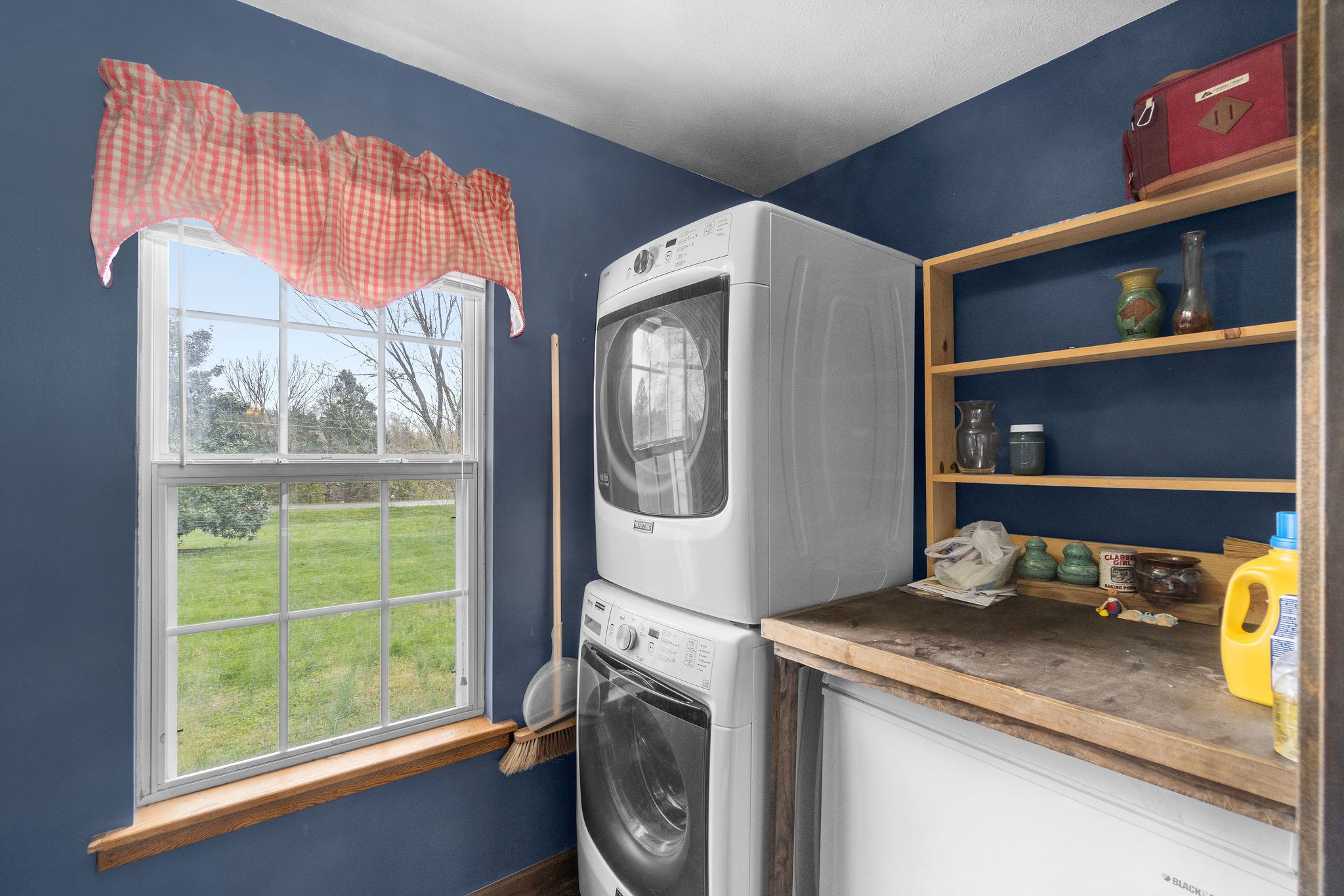 4450 Old Metal Road Palmyra, TN 37142 - Photo 13 of 38 a utility room with cabinets and a window