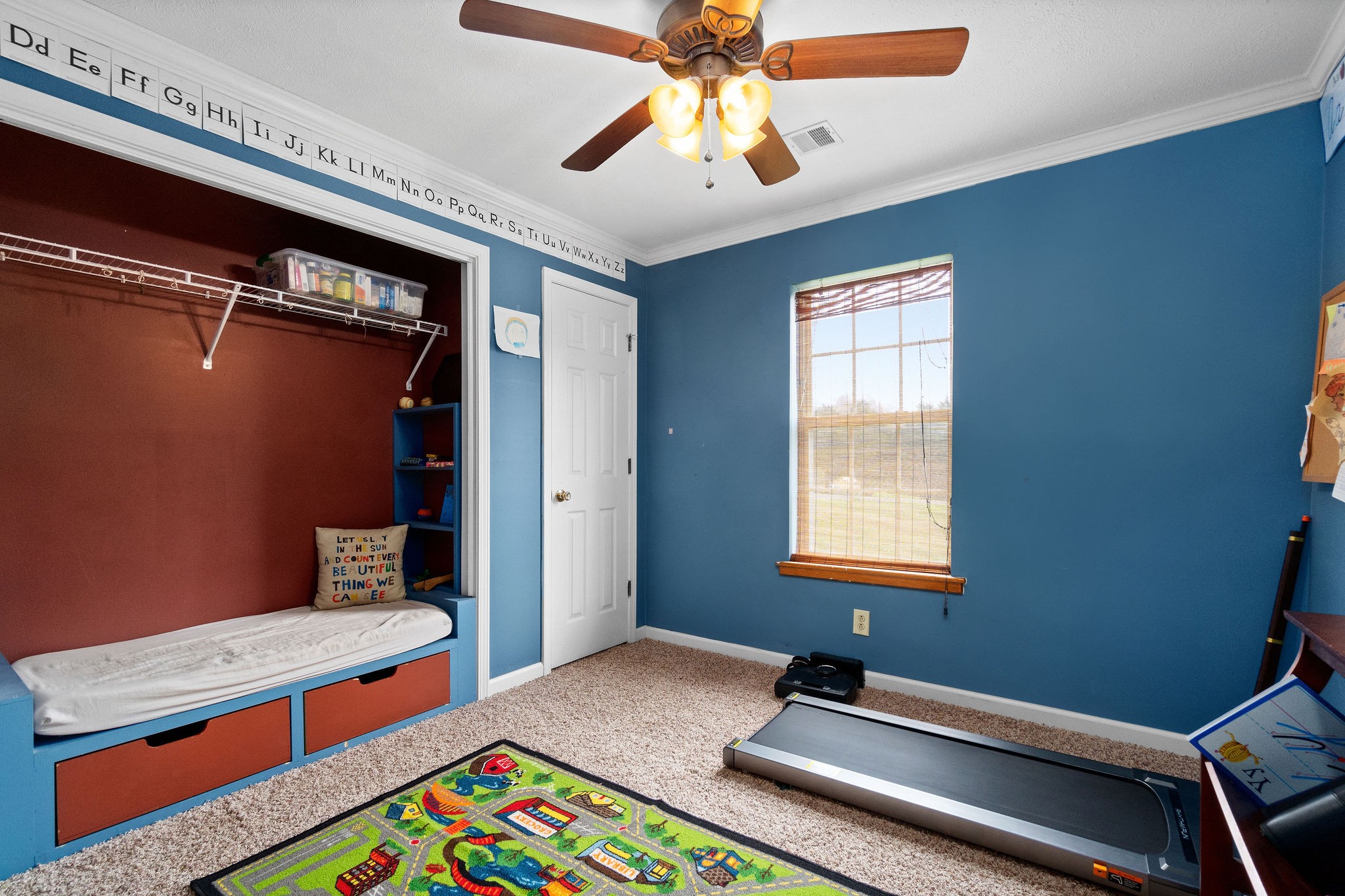 4450 Old Metal Road Palmyra, TN 37142 - Photo 14 of 38 a bedroom with a bed and a chandelier