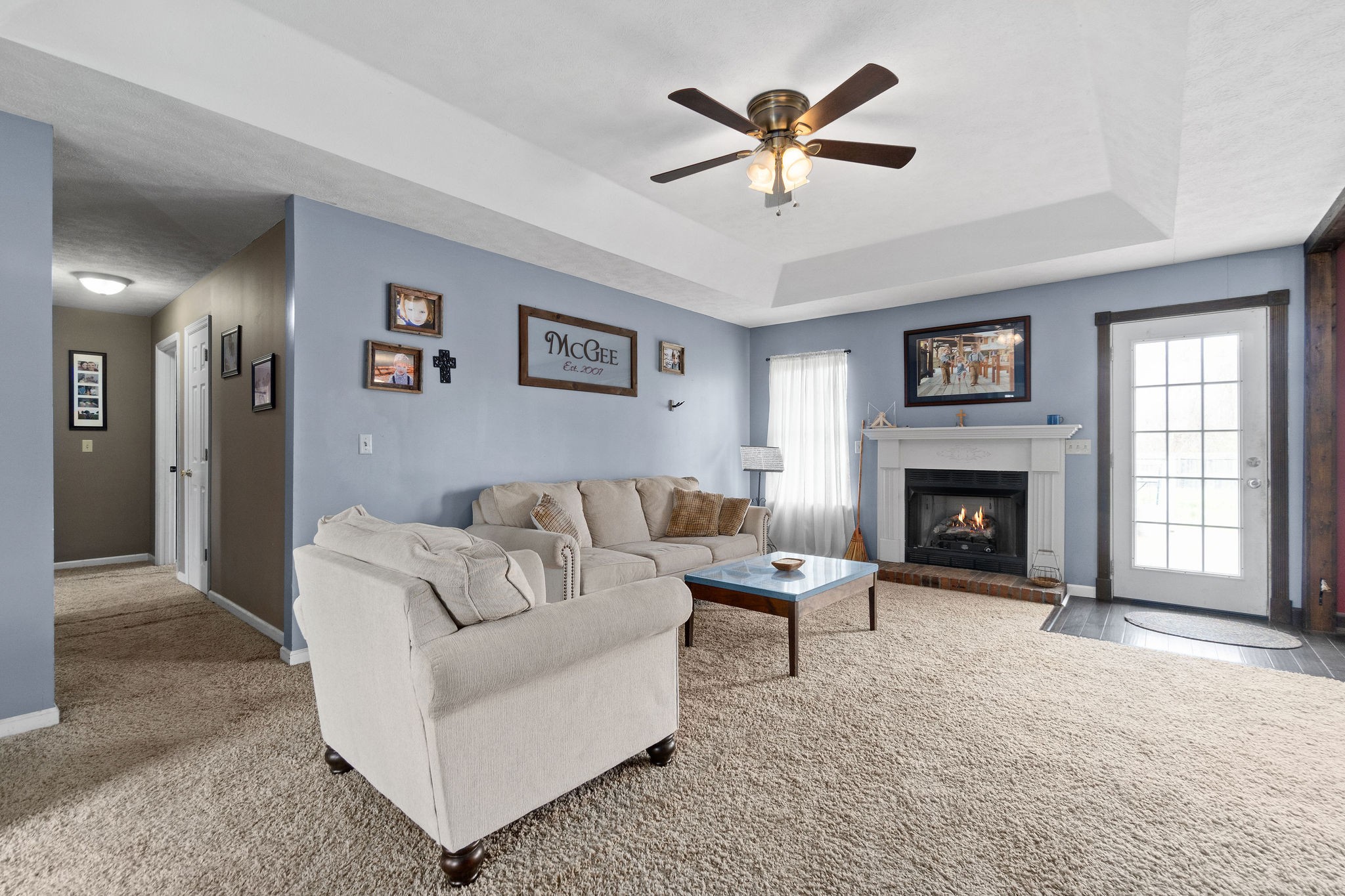 4450 Old Metal Road Palmyra, TN 37142 - Photo 3 of 38 a living room with furniture and a fireplace
