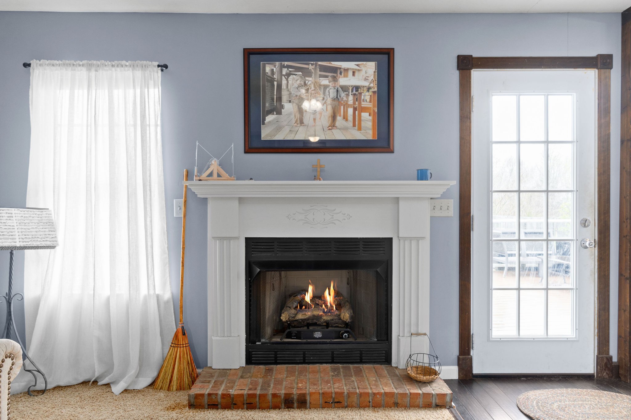 4450 Old Metal Road Palmyra, TN 37142 - Photo 5 of 38 a living room with a fireplace and a window