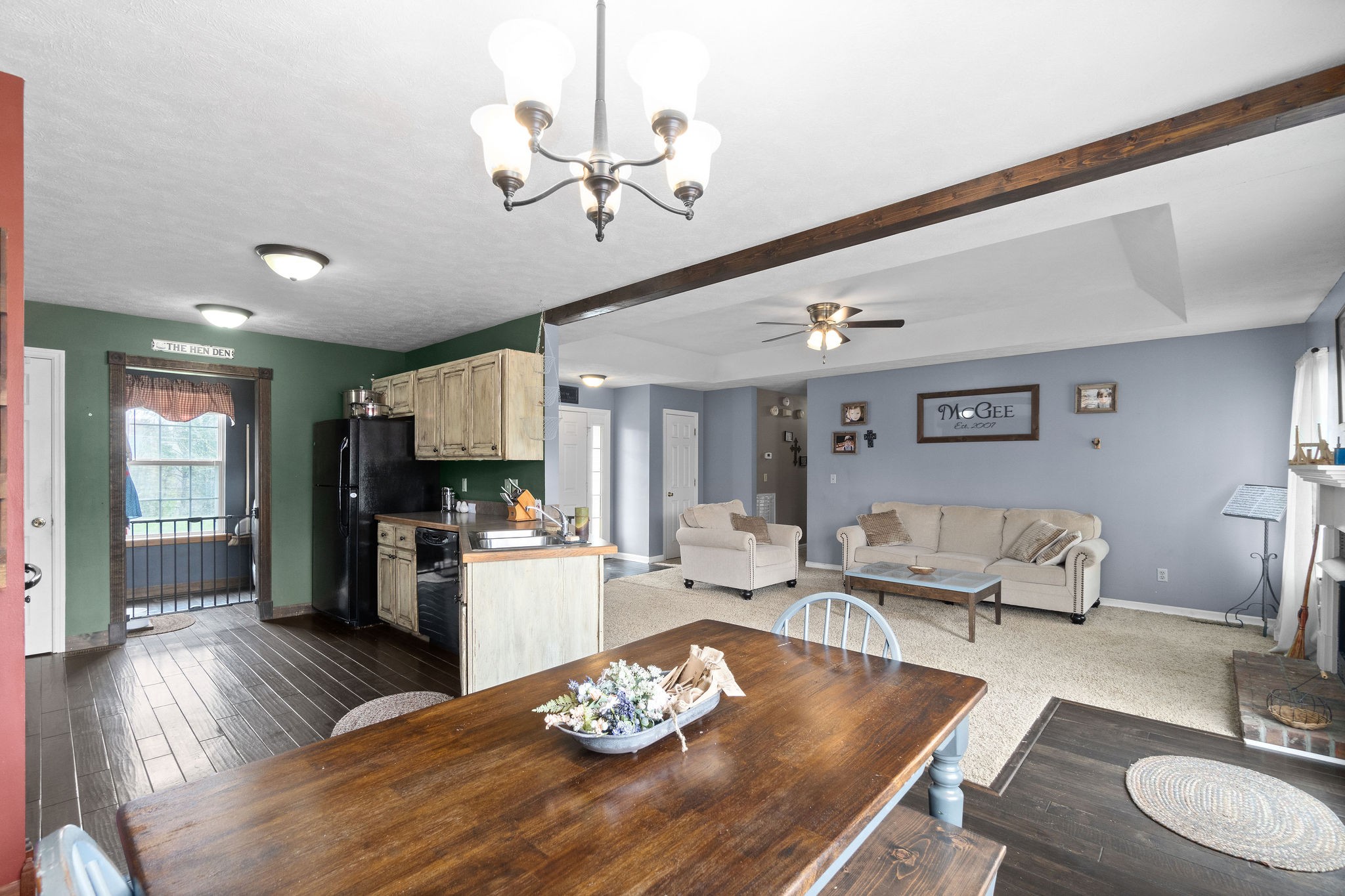 4450 Old Metal Road Palmyra, TN 37142 - Photo 9 of 38 a living room with furniture kitchen view and a wooden floor