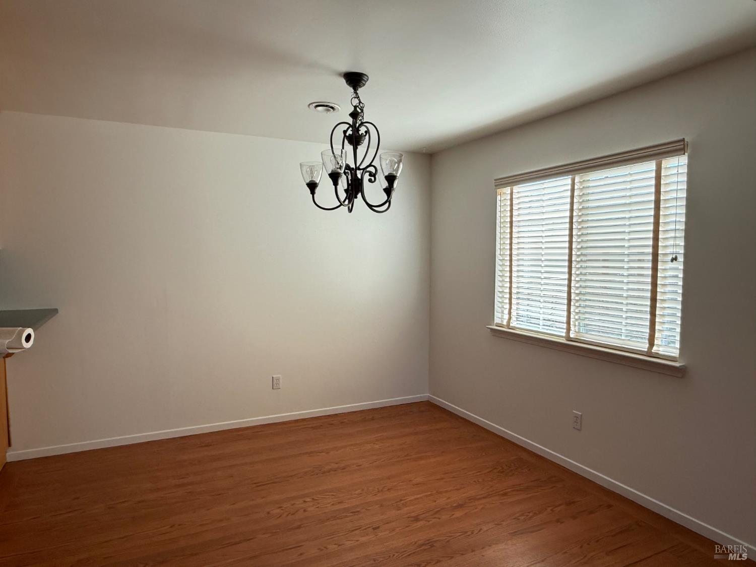 2553 Cactus Avenue Santa Rosa, CA 95405 - Photo 6 of 15 a view of a room that has a window and wooden floor