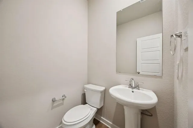 an empty room with fan and windows