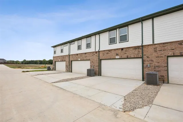 a front view of a house with garage