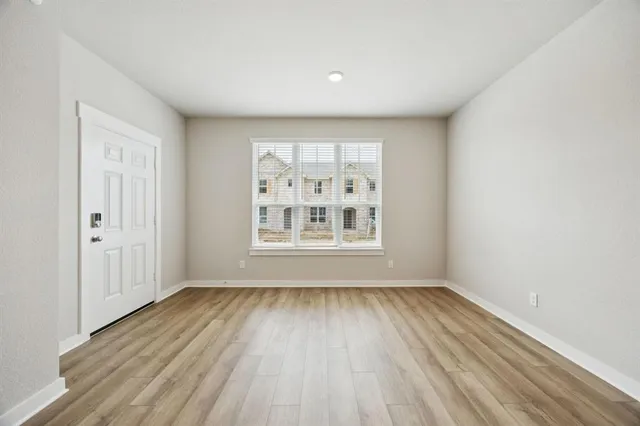 a view of a dining room with furniture and a chandelier