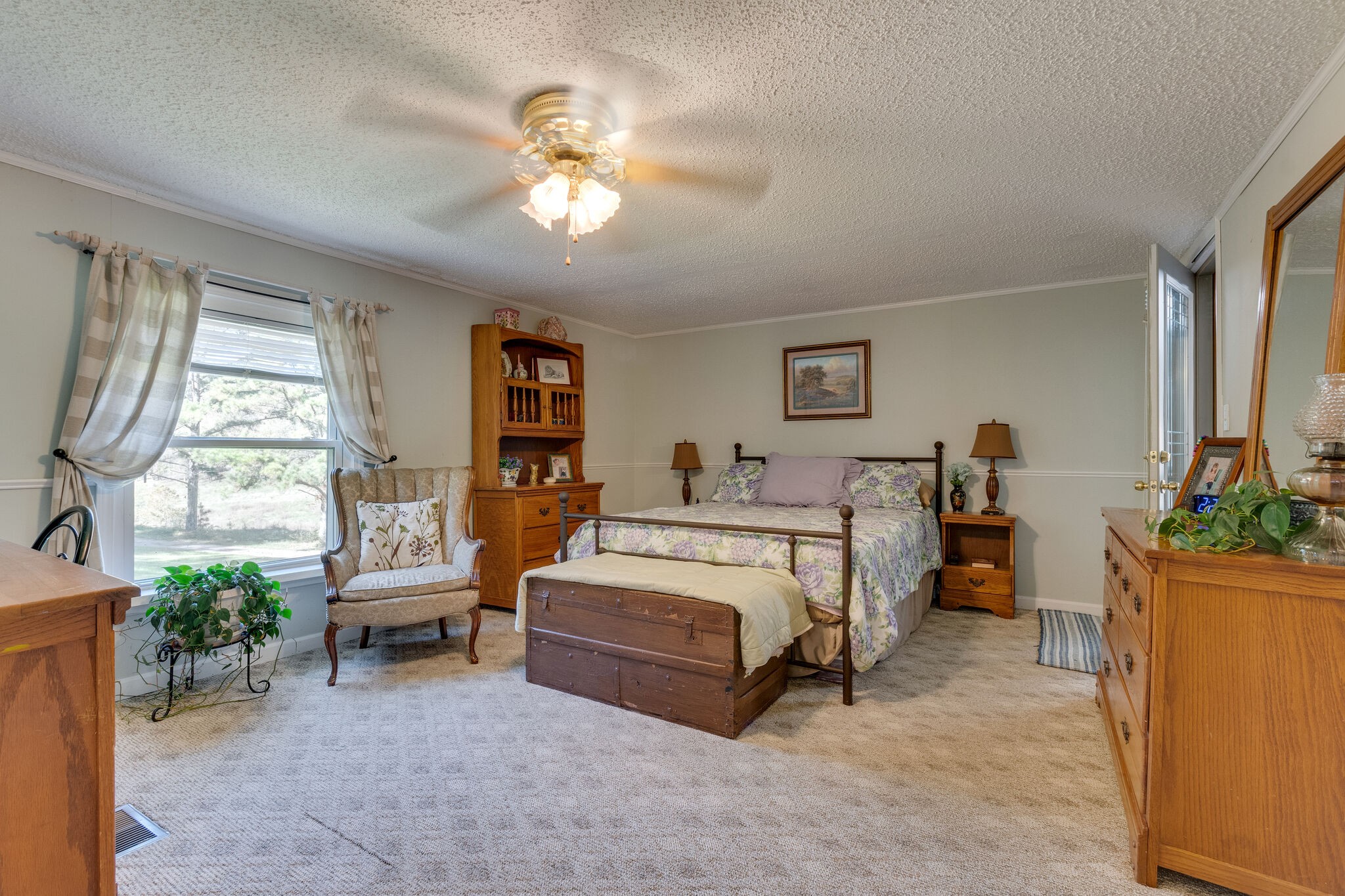 2844 Ragsdale Road Santa Fe, TN 38482 - Photo 22 of 45 a spacious bedroom with a bed and a chandelier