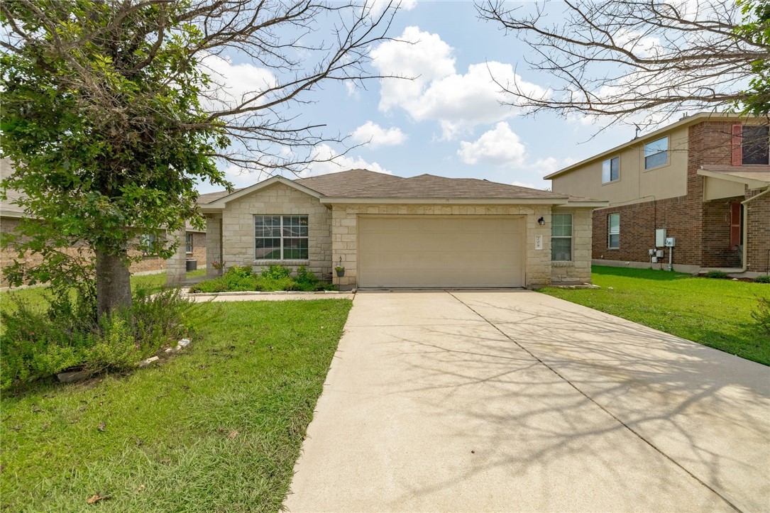 208 Banner Avenue Leander, TX 78641 - Photo 1 of 1 a front view of a house with a garden
