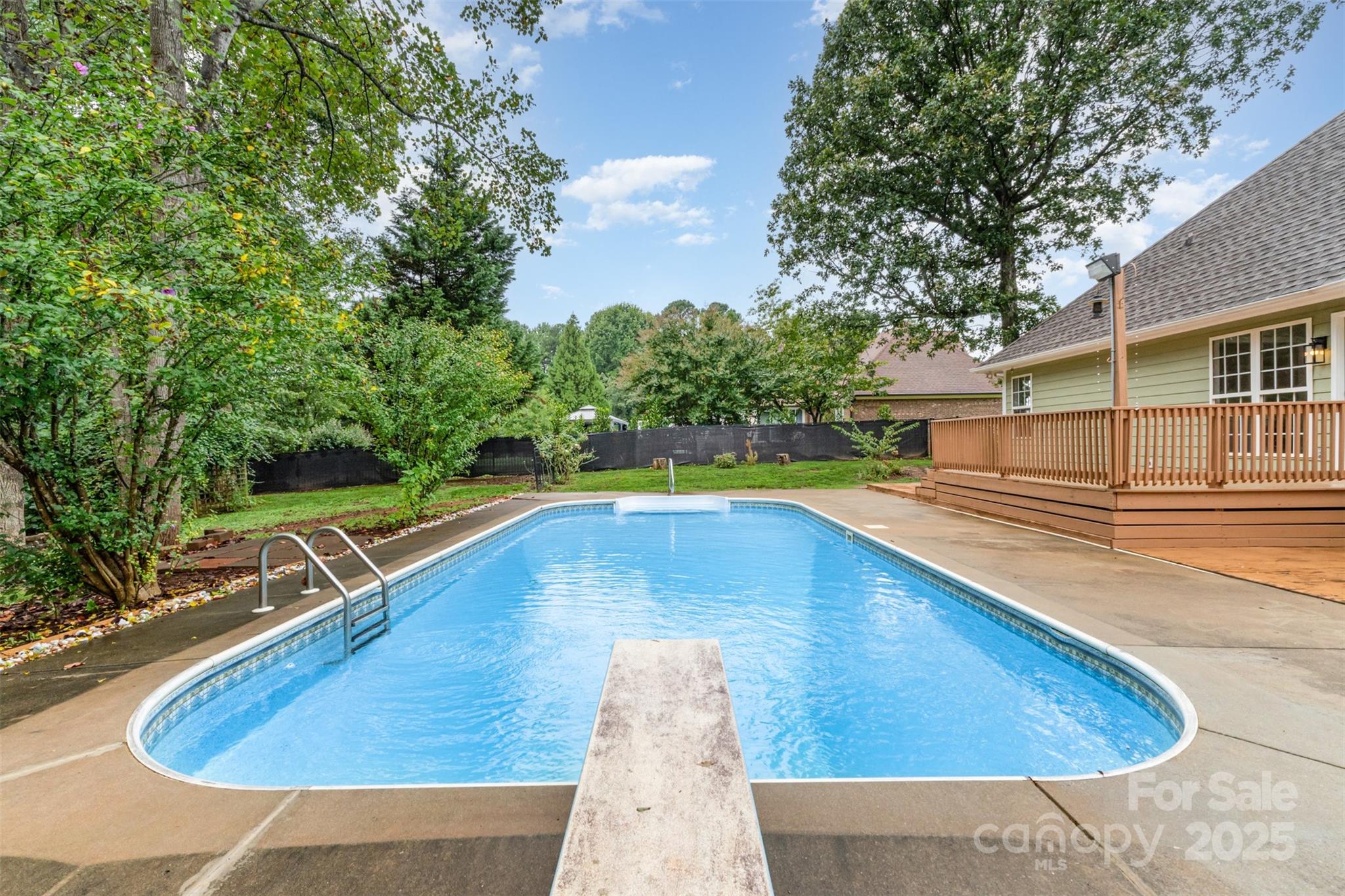 125 Stumpy Creek Road Mooresville, NC 28117 - Photo 13 of 23 a view of a swimming pool with a lounge chair