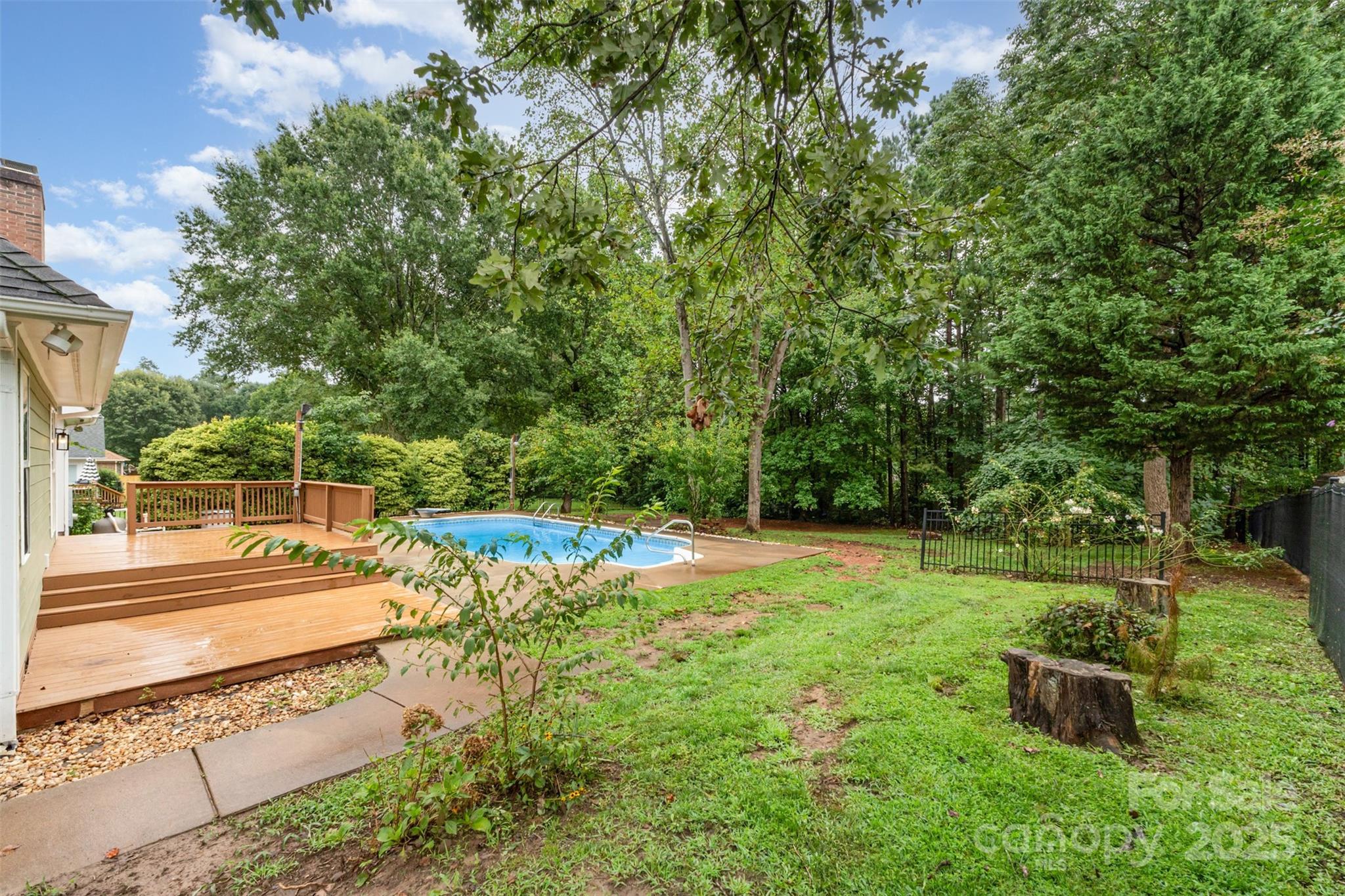 125 Stumpy Creek Road Mooresville, NC 28117 - Photo 15 of 23 a view of a backyard with large trees