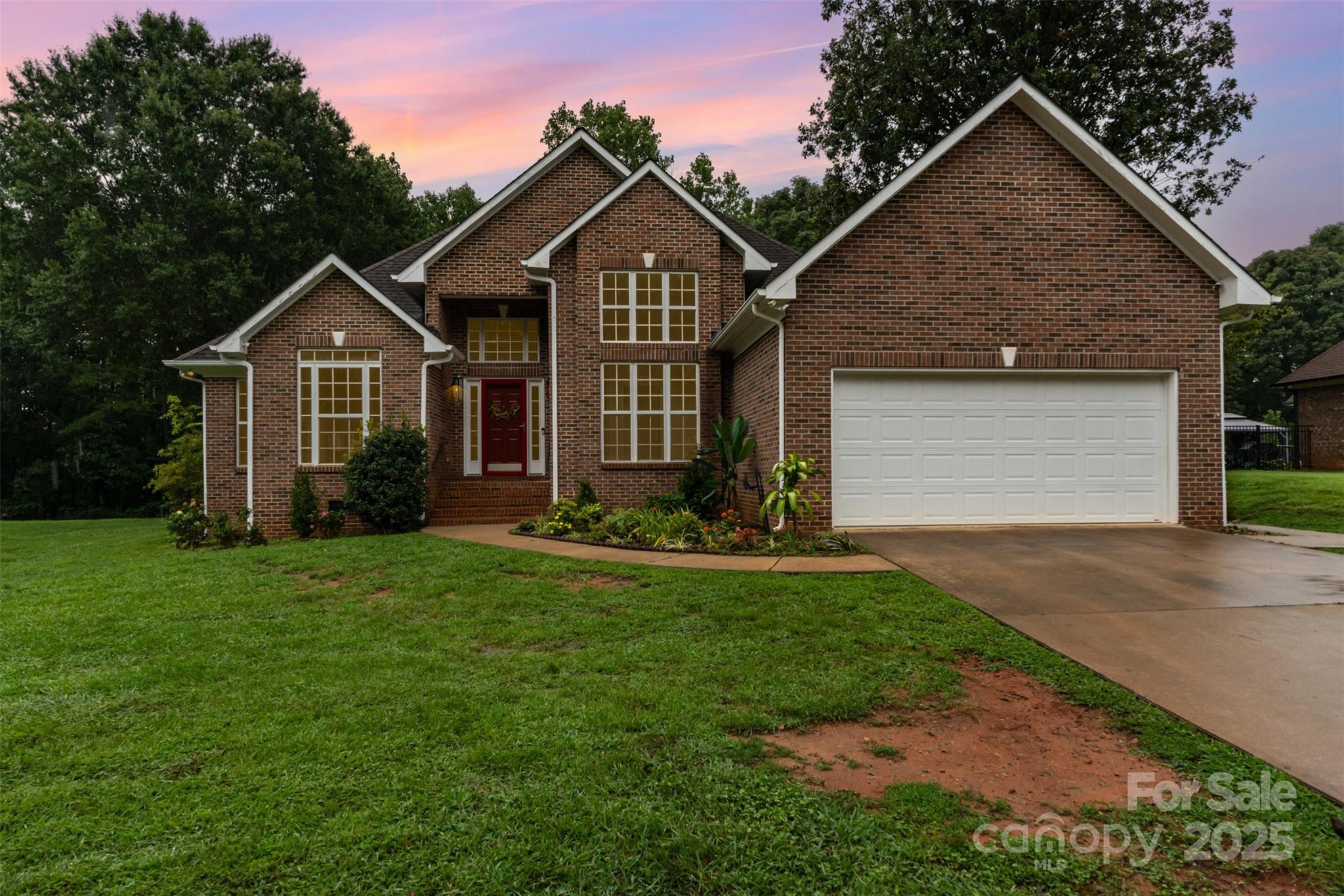 125 Stumpy Creek Road Mooresville, NC 28117 - Photo 2 of 23 a front view of a house with a yard and garage