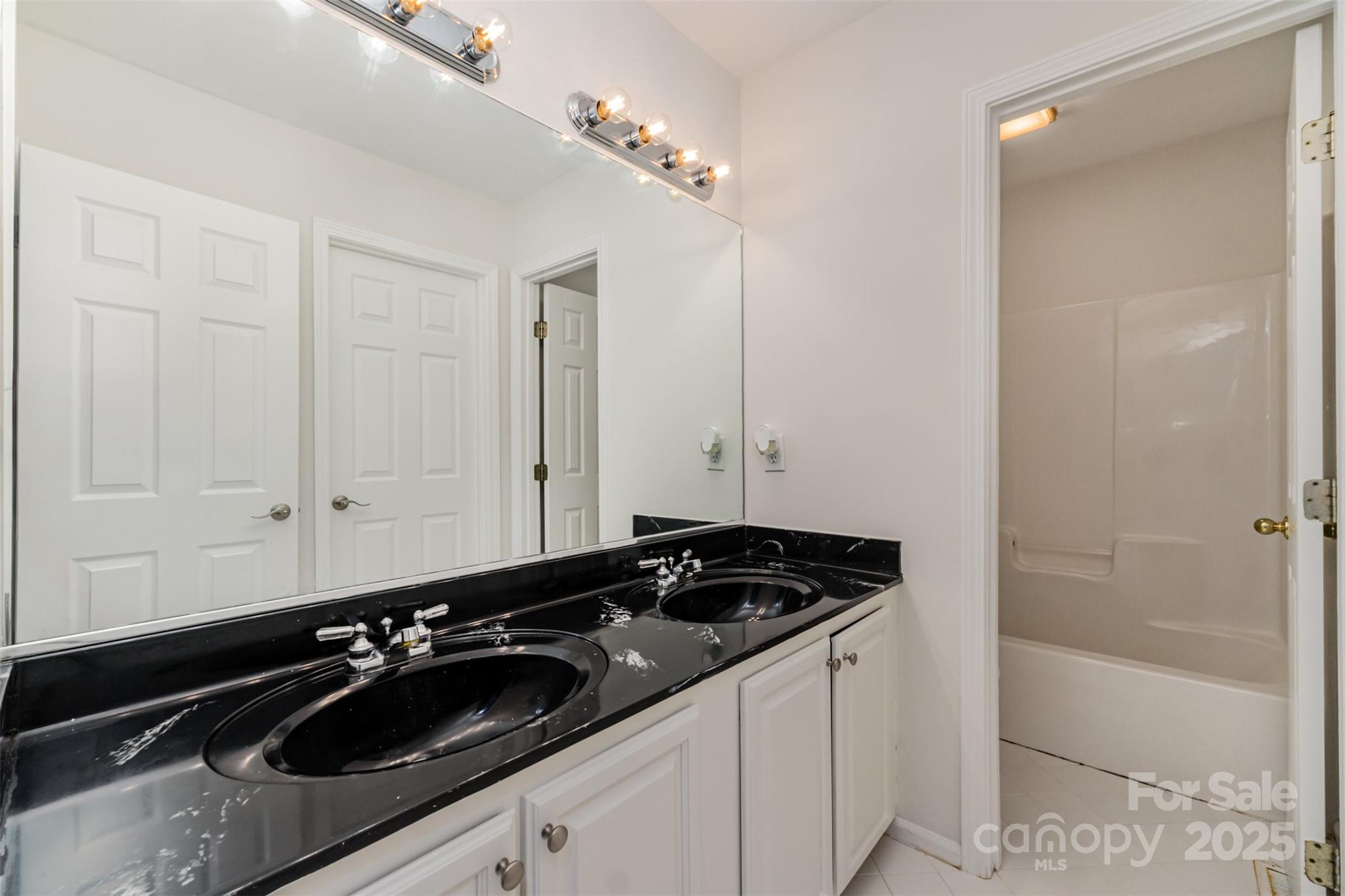 125 Stumpy Creek Road Mooresville, NC 28117 - Photo 21 of 23 a bathroom with a sink and a mirror