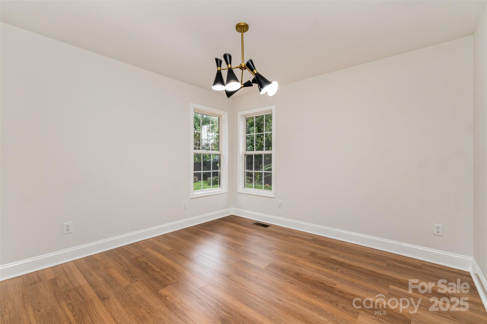 125 Stumpy Creek Road Mooresville, NC 28117 - Photo 22 of 23 a view of a room with wooden floor ceiling fan and window