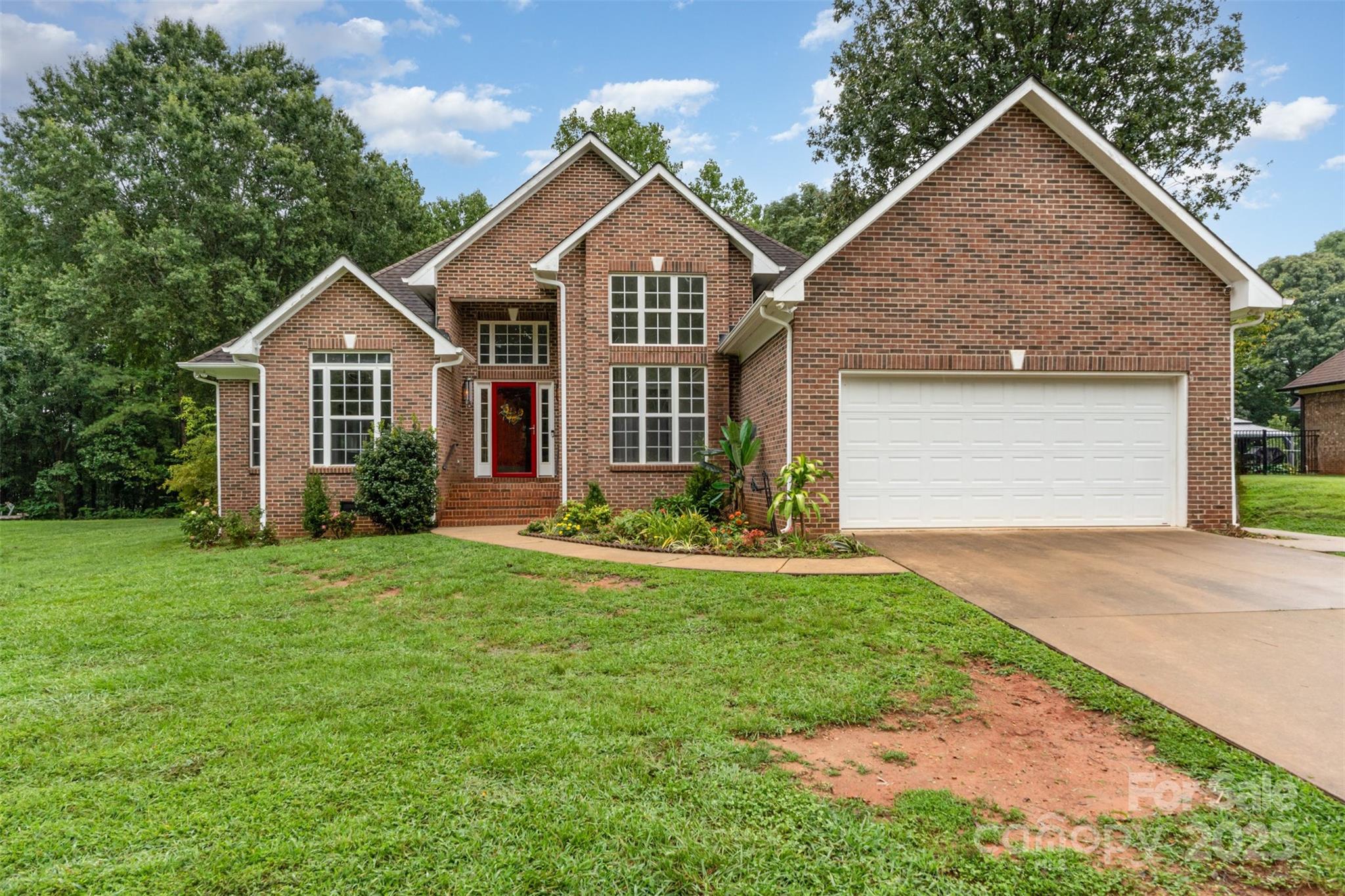125 Stumpy Creek Road Mooresville, NC 28117 - Photo 3 of 23 a front view of a house with a yard and garage