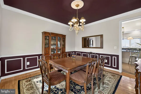 a kitchen with kitchen island granite countertop a sink stainless steel appliances and cabinets