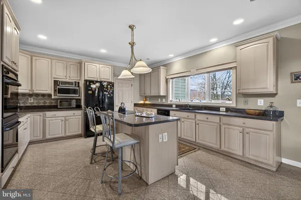 a spacious bathroom with a double vanity sink mirror and a shower