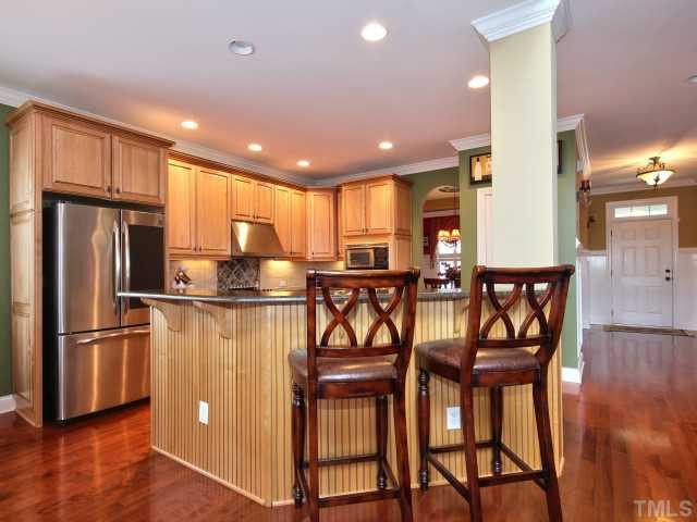 10149 Darling Street Raleigh, NC 27613 - Photo 6 of 25 You have plenty of room for guests at your granite bar that has beautiful beadboard molding! Kitchen