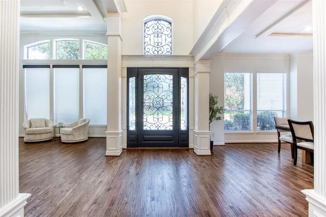 a view of livingroom with furniture wooden floor and windows
