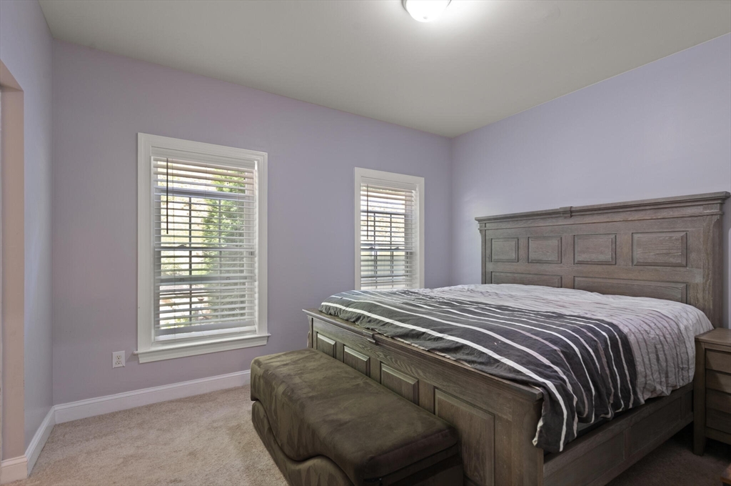 284 Maple Street, Unit 284 Middleton, MA 01949 - Photo 15 of 30 a bedroom with a bed and window