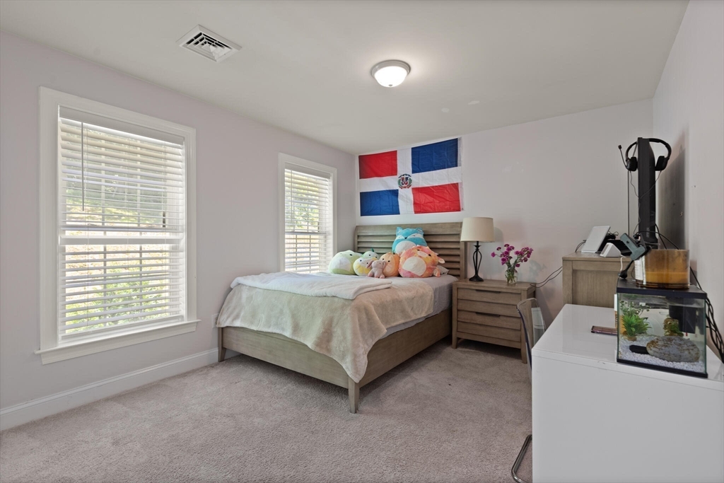 284 Maple Street, Unit 284 Middleton, MA 01949 - Photo 20 of 30 a bedroom with bed and a window