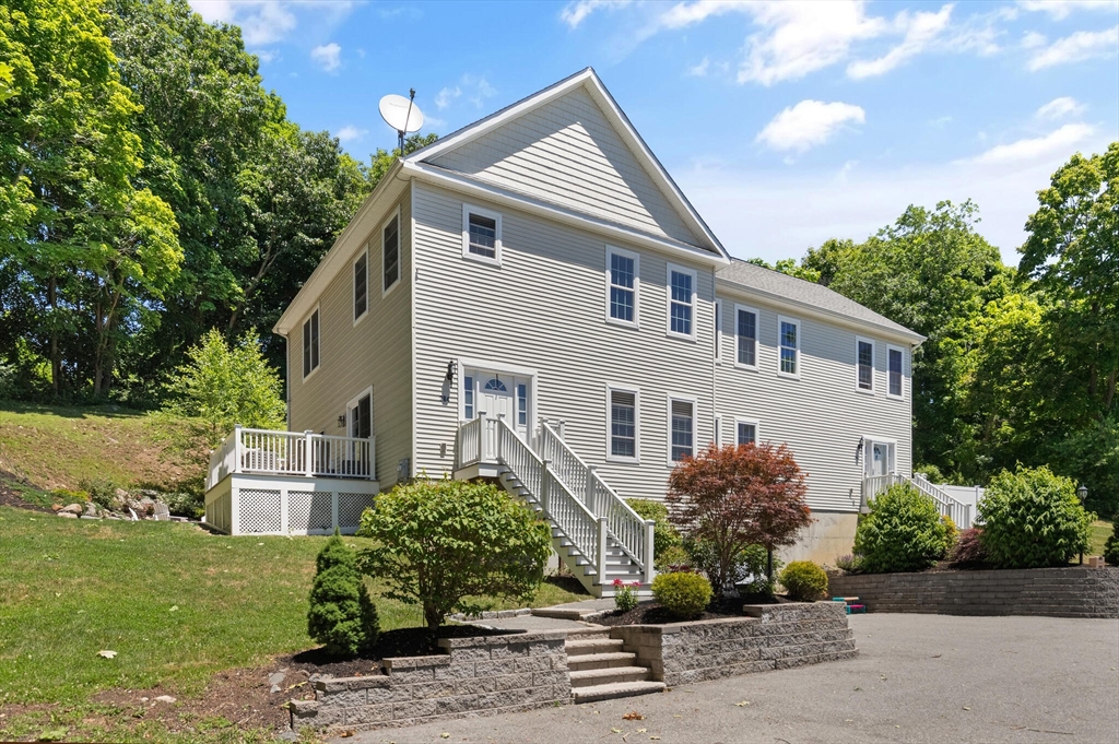 284 Maple Street, Unit 284 Middleton, MA 01949 - Photo 3 of 30 a front view of a house with a yard