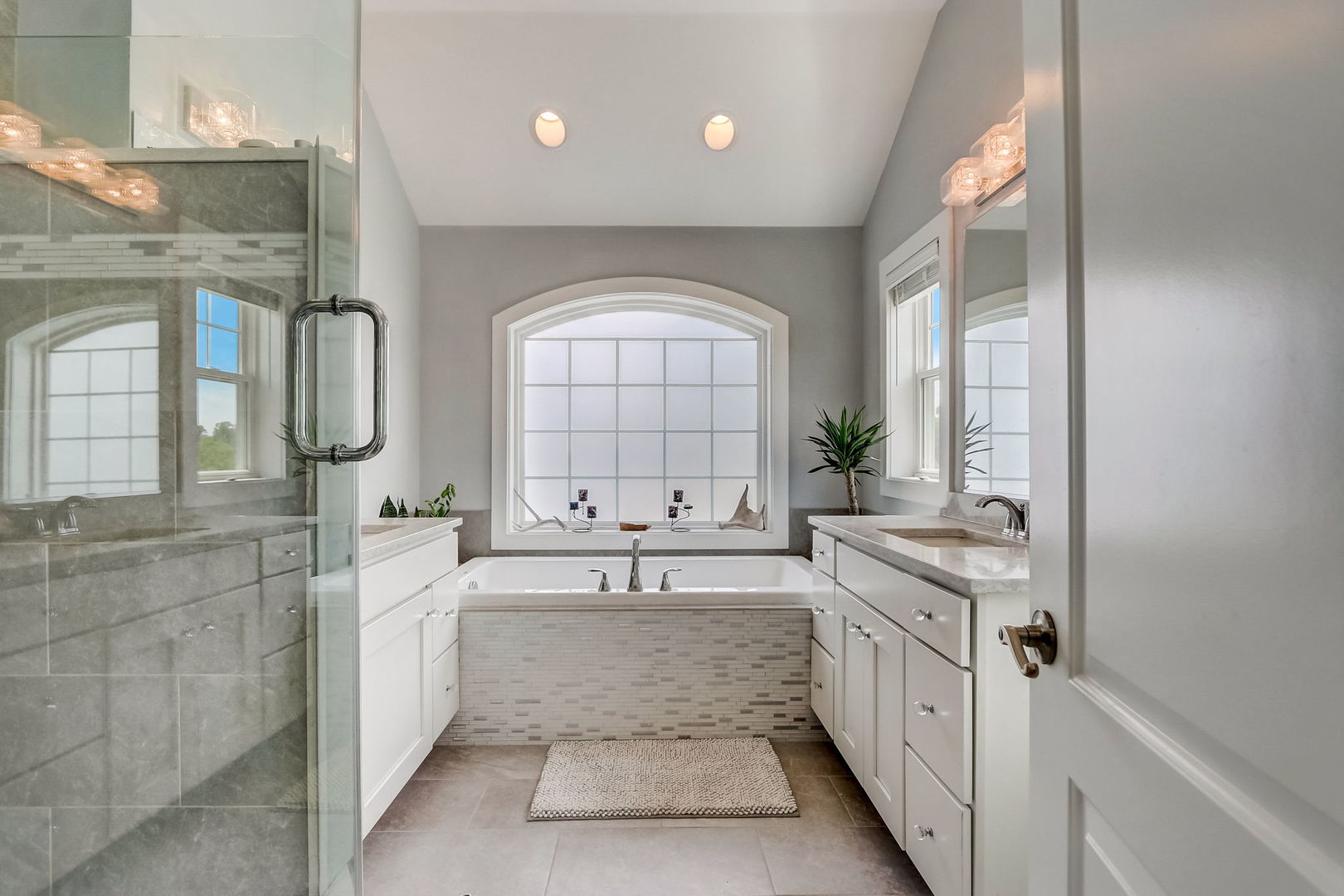 204 Fairbank Road Riverside, IL 60546 - Photo 14 of 35 a large bathroom with a tub a double vanity sink a mirror a vanity and a shower