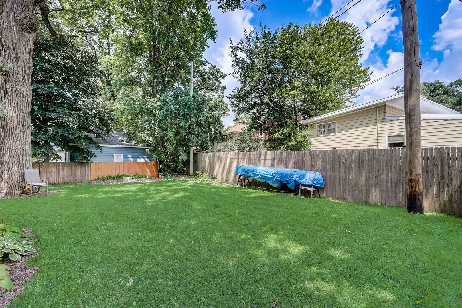 204 Fairbank Road Riverside, IL 60546 - Photo 29 of 35 a view of a backyard with large tree and wooden fence