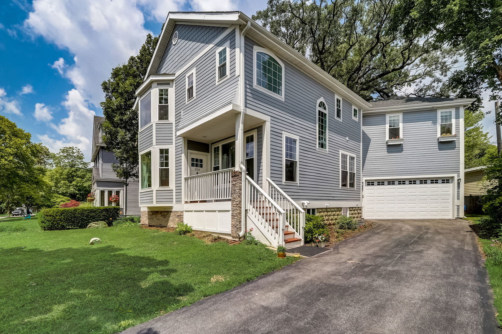 204 Fairbank Road Riverside, IL 60546 - Photo 32 of 35 a front view of a house with a garden and trees