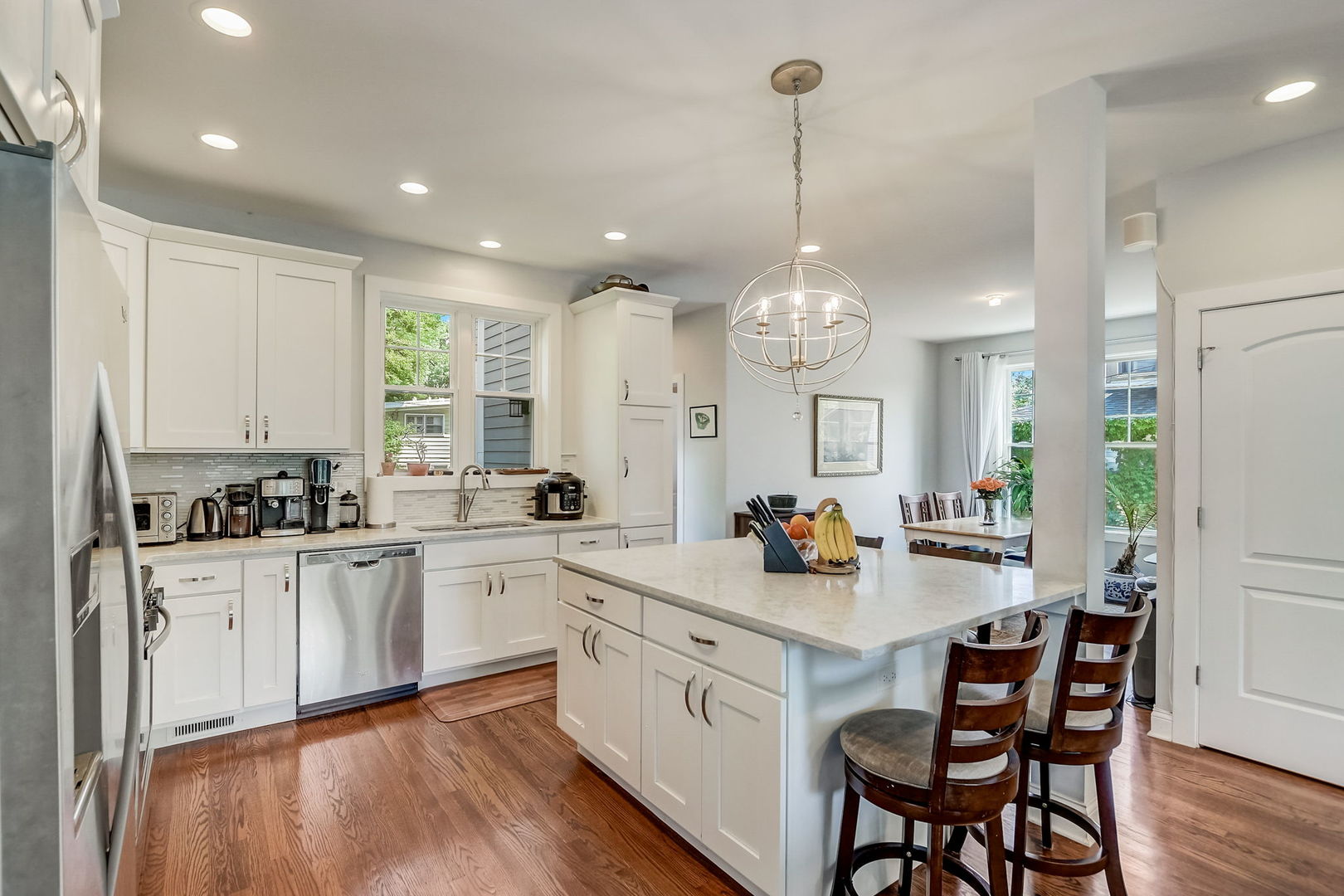 204 Fairbank Road Riverside, IL 60546 - Photo 6 of 35 a kitchen with a sink cabinets and wooden floor