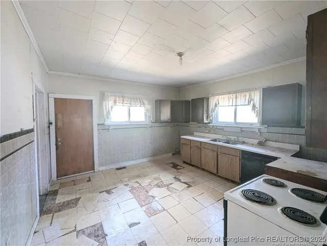 a kitchen with stainless steel appliances granite countertop a sink and cabinets