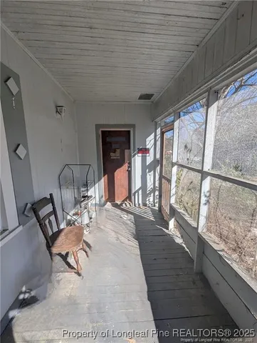 a view of a dining room with furniture wooden floor and a rug