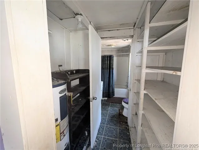 a bathroom with a tub sink and a shower