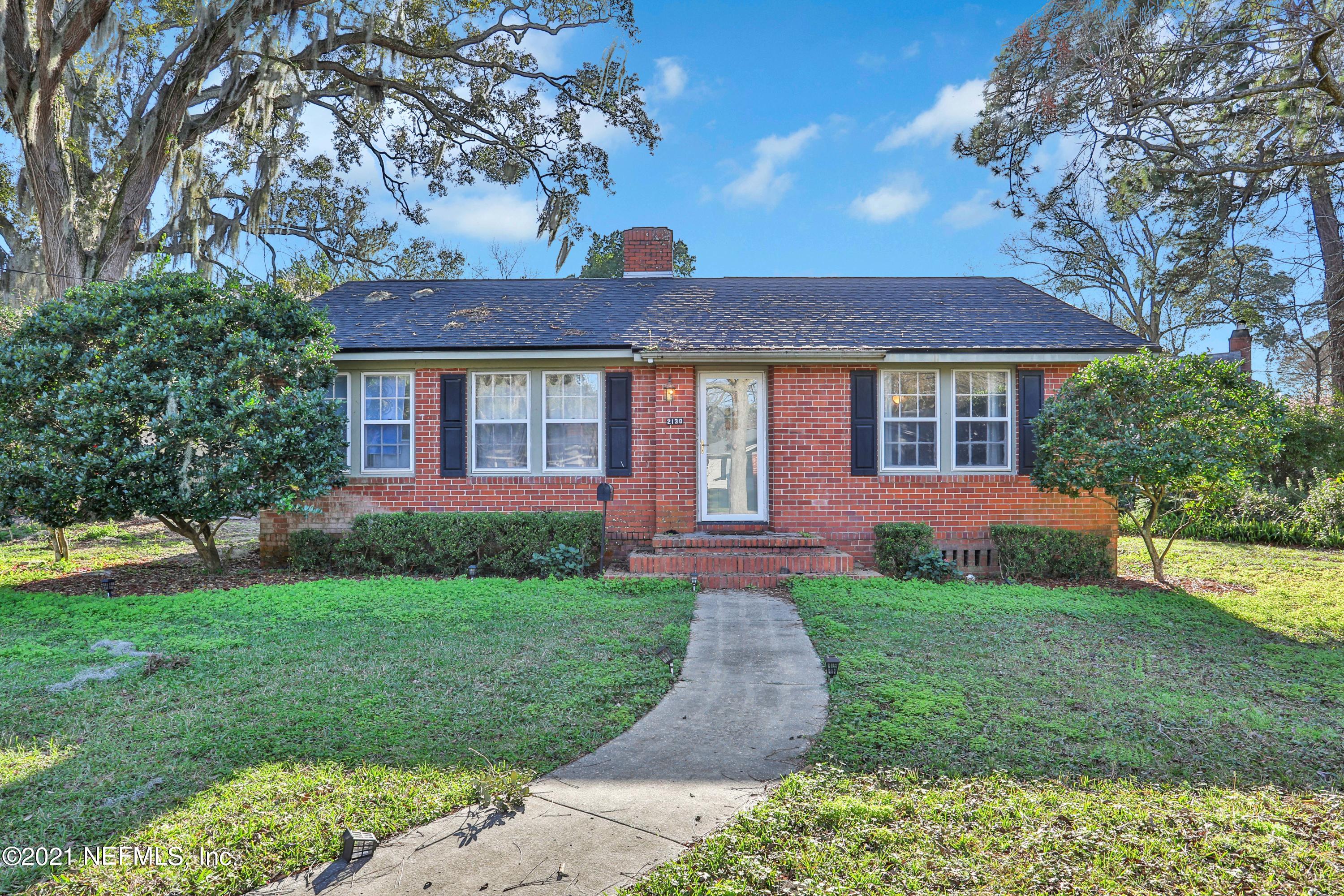 2130 Huntsford Road Jacksonville, FL 32207 - Photo 1 of 11 a front view of a house with a yard