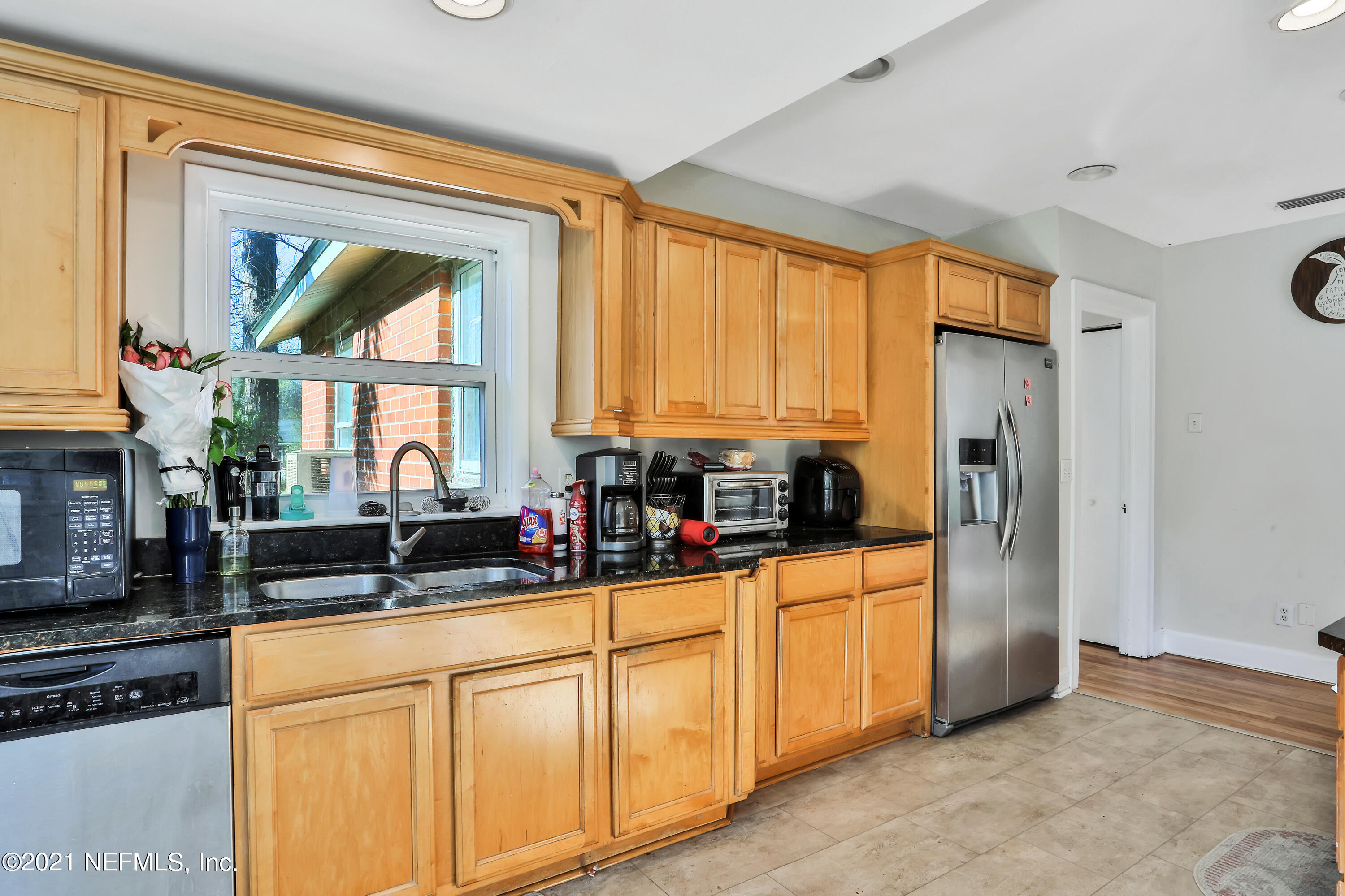 2130 Huntsford Road Jacksonville, FL 32207 - Photo 4 of 11 a kitchen with stainless steel appliances granite countertop a stove a sink and a refrigerator