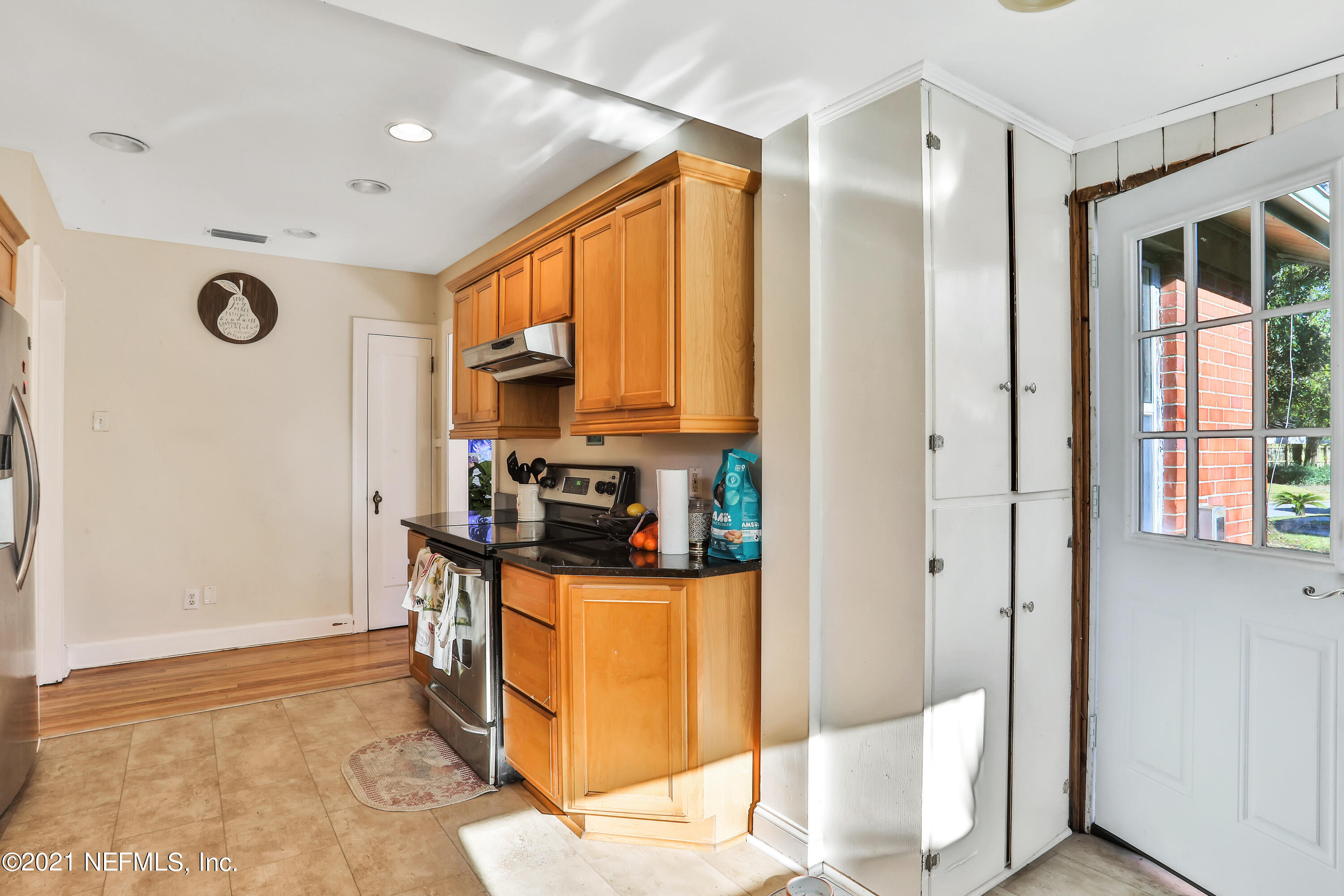 2130 Huntsford Road Jacksonville, FL 32207 - Photo 5 of 11 a kitchen with stainless steel appliances granite countertop a refrigerator and a stove