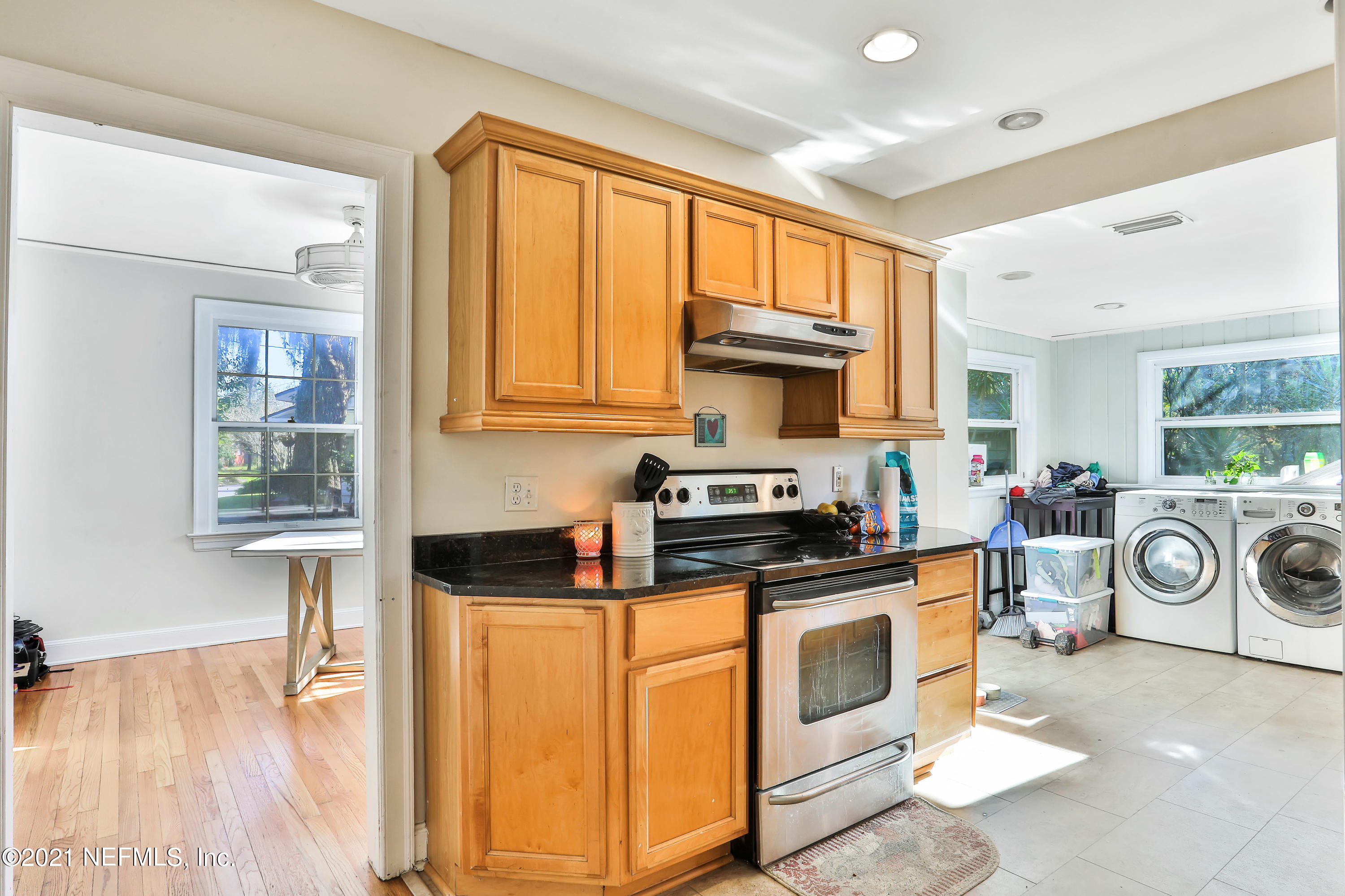 2130 Huntsford Road Jacksonville, FL 32207 - Photo 6 of 11 a kitchen with stainless steel appliances granite countertop a stove a sink and a microwave