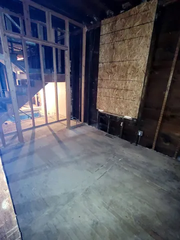 a view of an empty room with a window