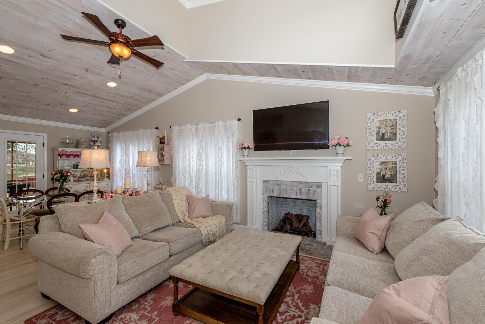 5017 Morganton Road Greenback, TN 37742 - Photo 12 of 40 a living room with furniture a fireplace and a flat screen tv