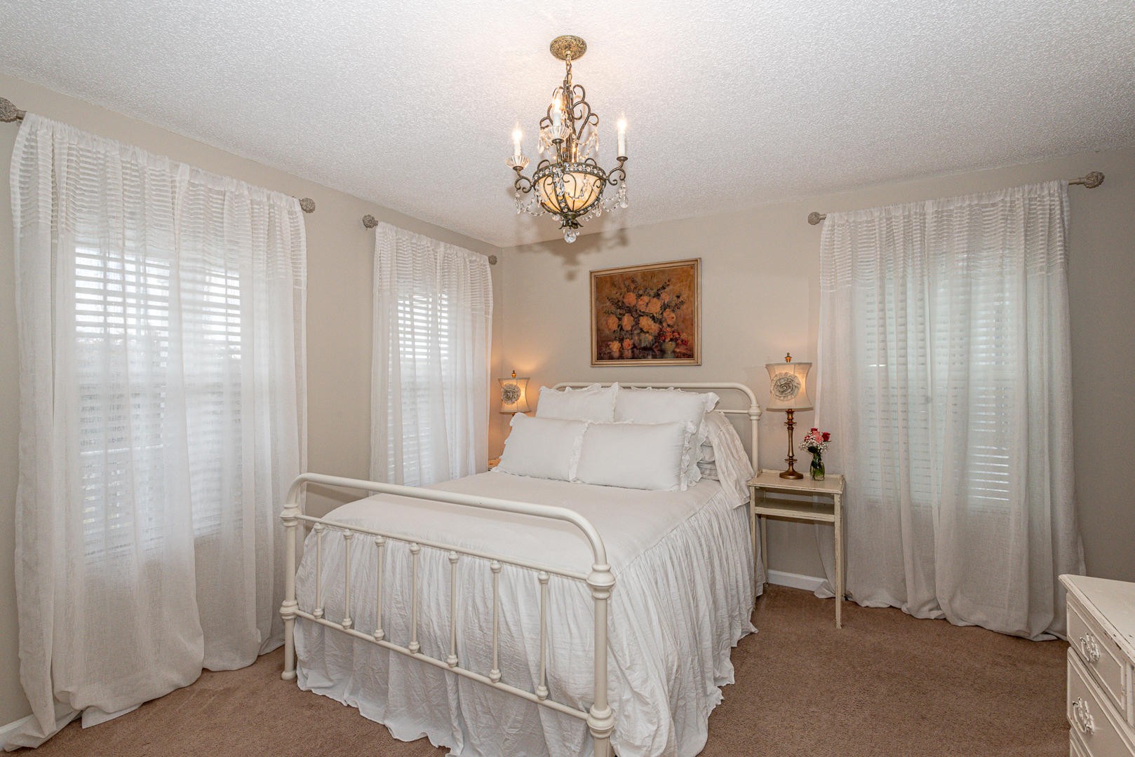 5017 Morganton Road Greenback, TN 37742 - Photo 25 of 40 a bedroom with a bed and a chandelier