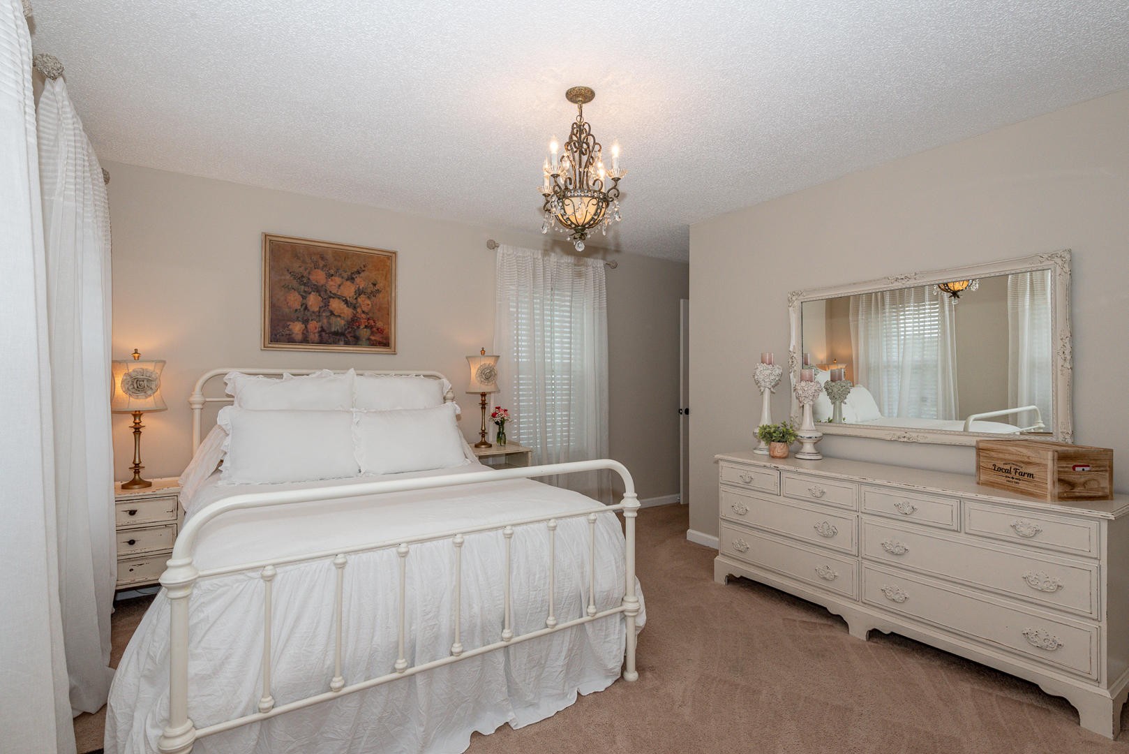5017 Morganton Road Greenback, TN 37742 - Photo 26 of 40 a spacious bedroom with a bed and a chandelier