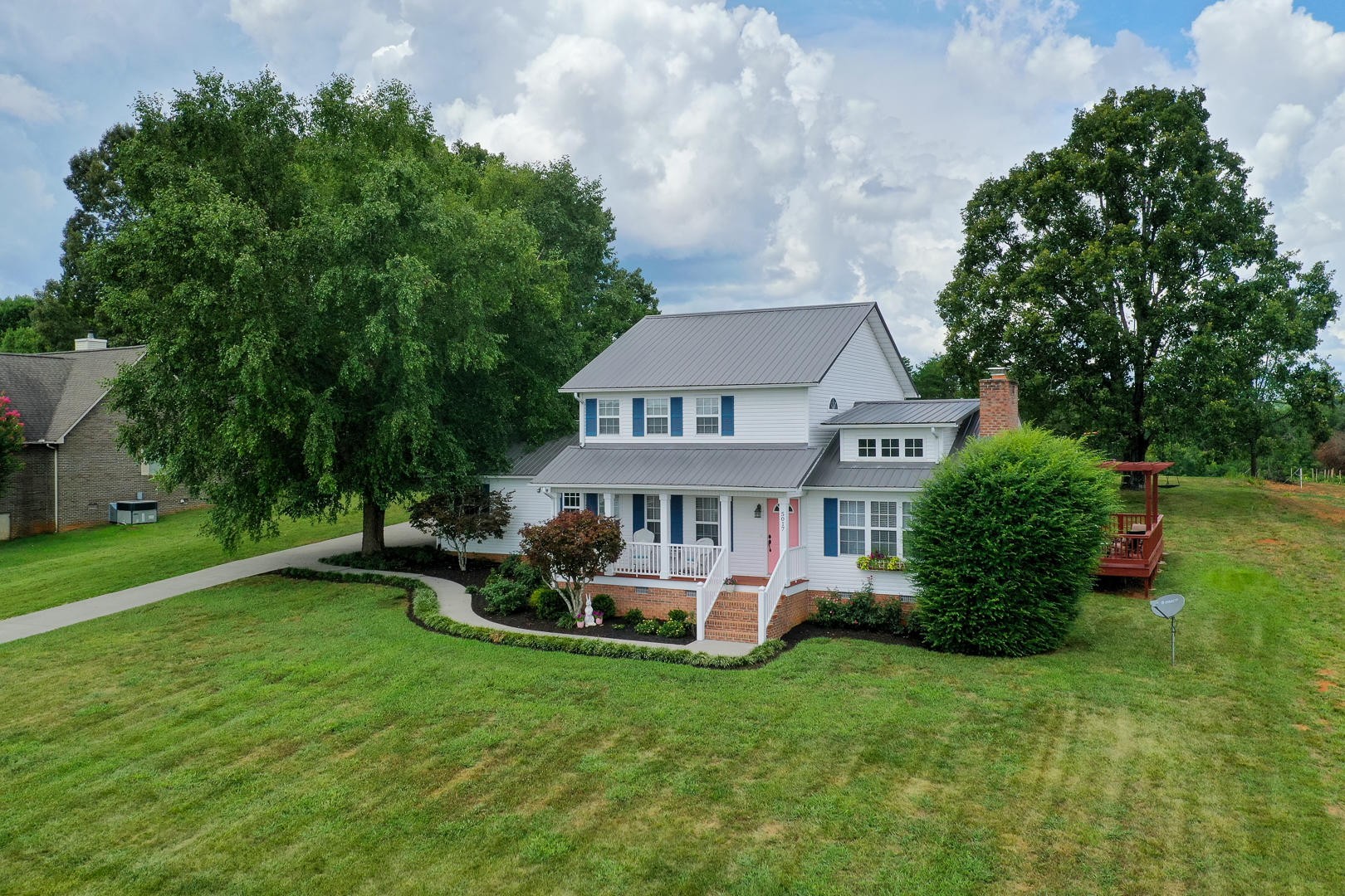 5017 Morganton Road Greenback, TN 37742 - Photo 3 of 40 a front view of a house with a garden