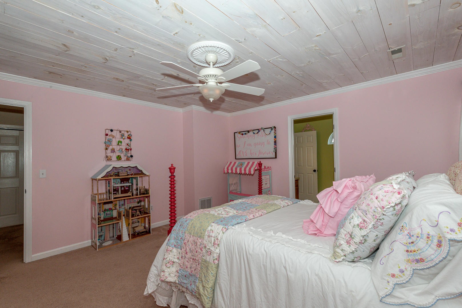 5017 Morganton Road Greenback, TN 37742 - Photo 31 of 40 a bedroom with a bed and a chandelier