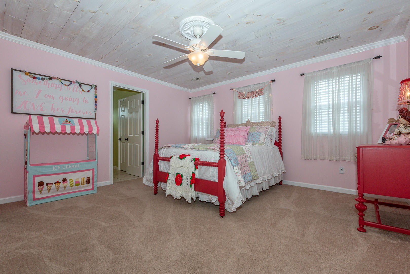 5017 Morganton Road Greenback, TN 37742 - Photo 32 of 40 a bedroom with a bed and a chandelier