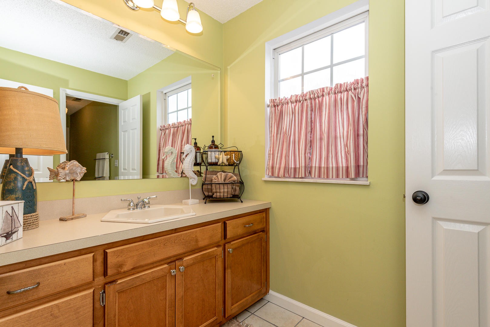 5017 Morganton Road Greenback, TN 37742 - Photo 35 of 40 a bathroom with a sink and a mirror