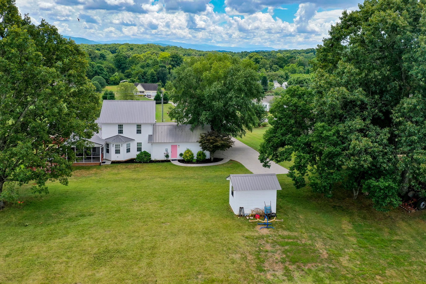 5017 Morganton Road Greenback, TN 37742 - Photo 4 of 40 an aerial view of a house with a garden and swimming pool