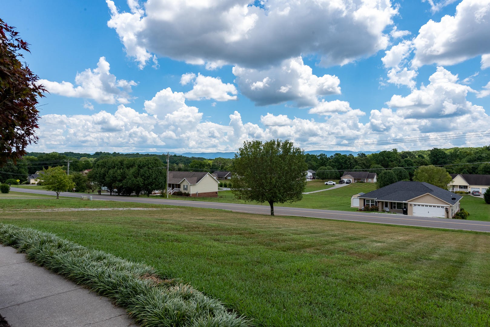 5017 Morganton Road Greenback, TN 37742 - Photo 7 of 40 a view of green field with house in the background