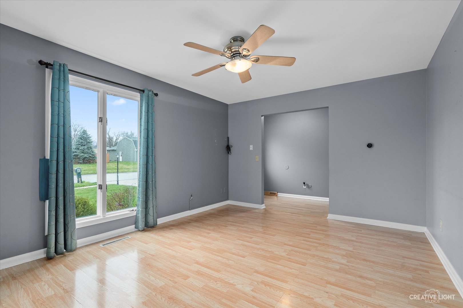 6 Ingleshire Road Montgomery, IL 60538 - Photo 4 of 16 a view of an empty room with wooden floor and a window