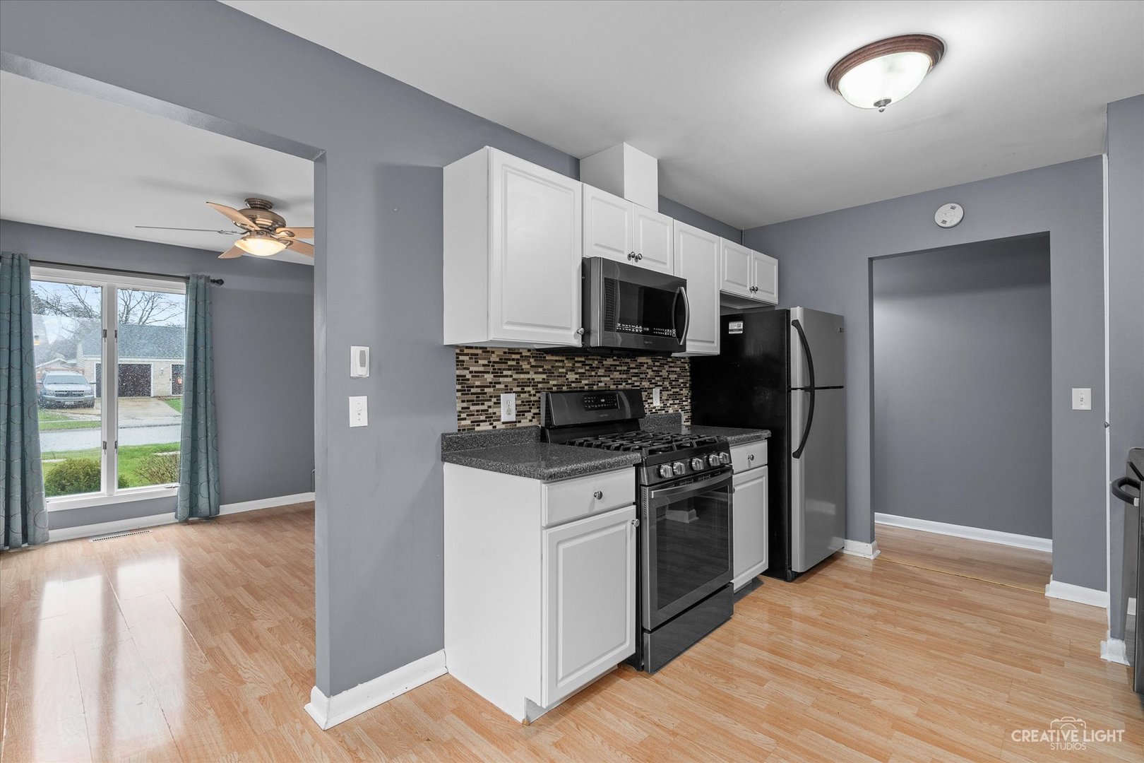 6 Ingleshire Road Montgomery, IL 60538 - Photo 5 of 16 a kitchen with a stove a sink and a microwave